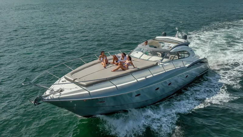 Slide: The Image of 1999 Sunseeker Predator 58 yacht cruising with passengers on deck. - 9