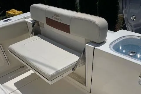 Slide: The Image of 2023 Cobia 237CC boat with foldable seat and built-in livewell. - 4