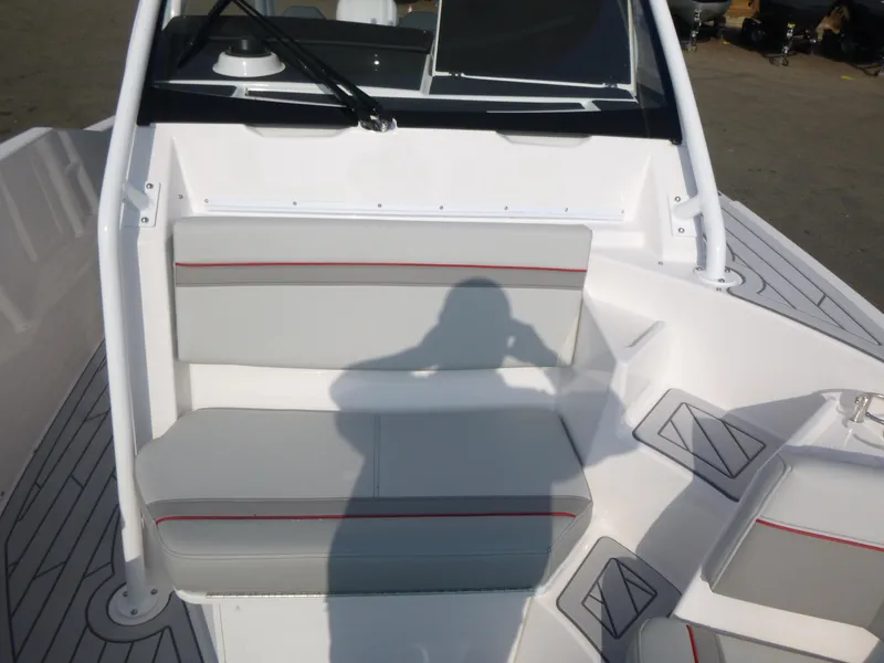 Slide: The Image of Interior of 2025 Solara S-250 CW boat with gray seating and red accents. - 13