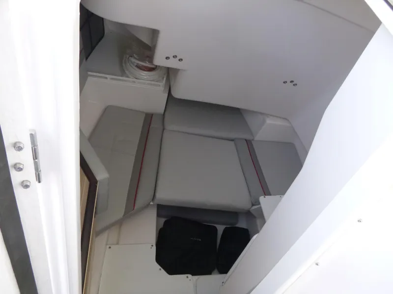 Slide: The Image of Interior cabin of 2025 Solara S-250 CW boat with gray seating. - 14