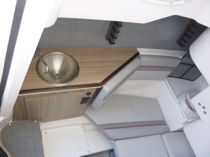 Slide: The Image of Interior of 2025 Solara S-250 CW boat with sink and seating area. - 15