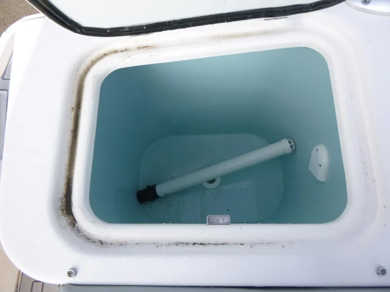 Slide: The Image of Open storage compartment of Solara S-250 CW 2025 boat, showing interior details. - 16