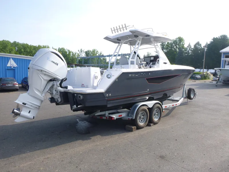 Slide: The Image of 2025 Solara S-250 CW boat on trailer with Yamaha outboard motor in parking lot. - 4