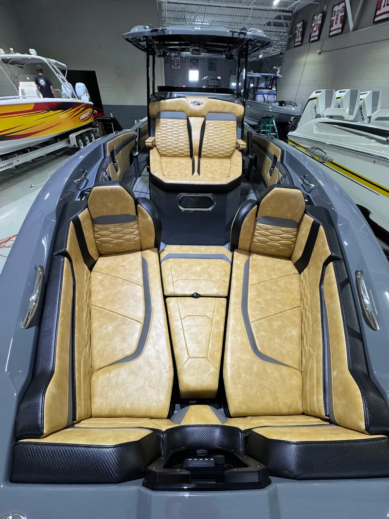 Slide: The Image of 2025 Sunsation 32 CCX boat interior with tan leather seating and modern design. - 13