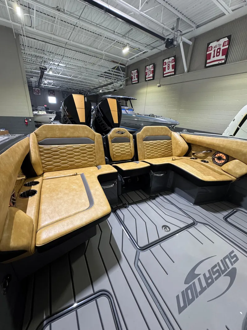 Slide: The Image of 2025 Sunsation 32 CCX boat interior with tan leather seating and modern design. - 18