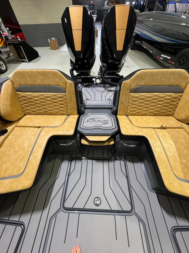 Slide: The Image of 2025 Sunsation 32 CCX boat interior with tan seating and dual engines. - 19
