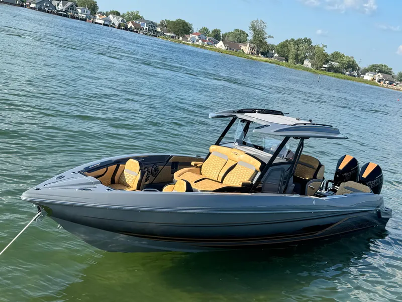 Slide: The Image of 2025 Sunsation 32 CCX boat on calm water, featuring sleek design and modern amenities. - 22