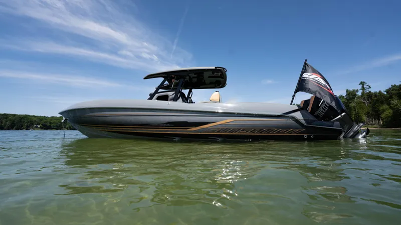 Slide: The Image of 2025 Sunsation 32 CCX boat on clear water under blue sky. - 3