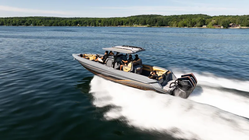 Slide: The Image of 2025 Sunsation 32 CCX speedboat cruising on a lake with passengers onboard. - 4