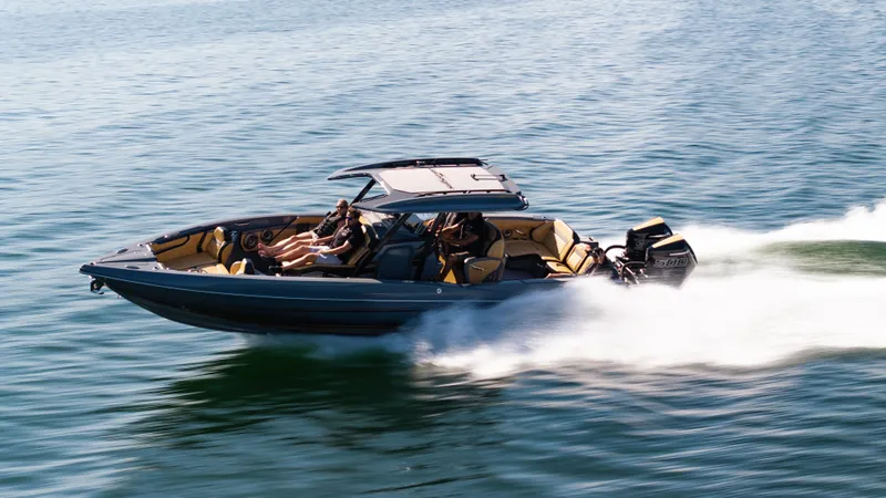 Slide: The Image of 2025 Sunsation 32 CCX speedboat cruising on water with passengers enjoying the ride. - 5