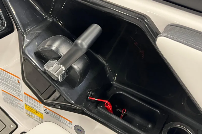 Slide: The Image of 2024 Yamaha Boats 195S throttle control and safety lanyard in cockpit area. - 10