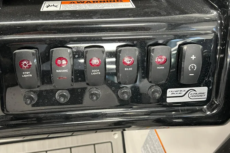 Slide: The Image of Control panel of 2024 Yamaha Boats 195S featuring various switches and cruise assist options. - 11