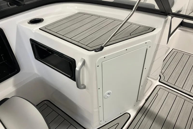 Slide: The Image of 2024 Yamaha Boats 195S interior with sleek storage compartment and modern design. - 12