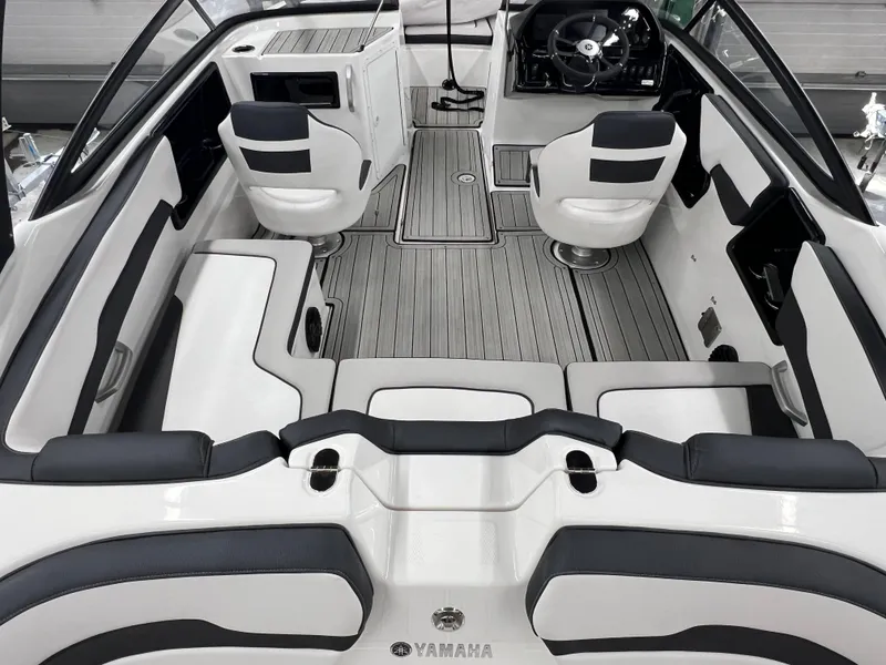 Slide: The Image of 2024 Yamaha Boats 195S interior with sleek seating and modern dashboard design. - 2