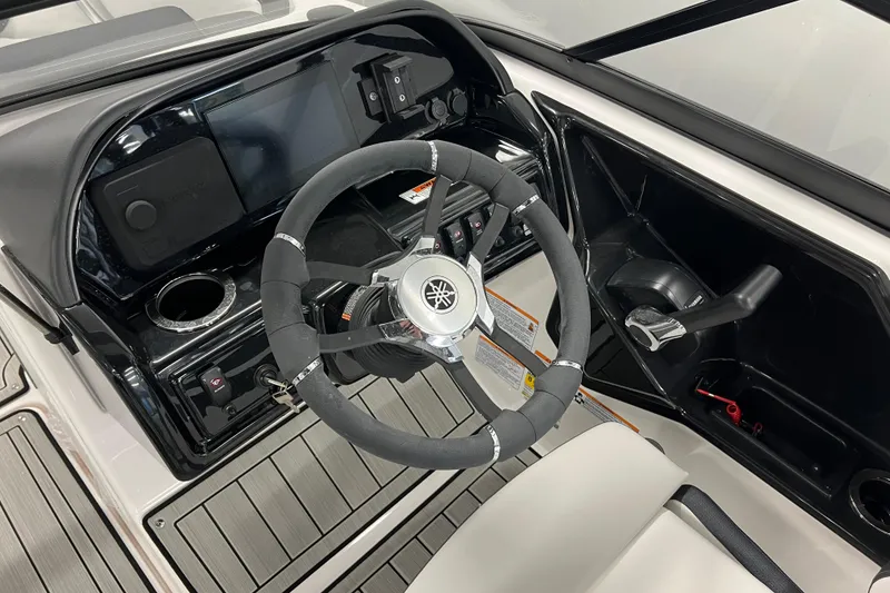 Slide: The Image of 2024 Yamaha Boats 195S cockpit with steering wheel and control panel. - 7