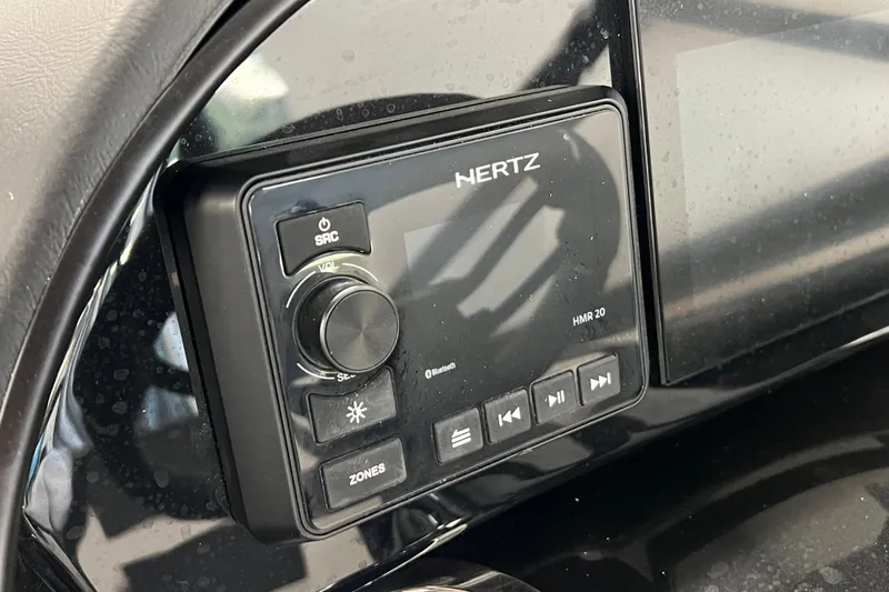 Slide: The Image of Control panel of a 2024 Yamaha Boats 195S featuring a Hertz HMR 20 audio system. - 8