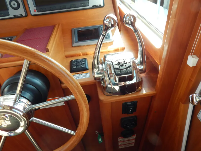 Slide: The Image of Steering wheel and controls of a 2010 Sabre 40 Sedan yacht cockpit. - 11