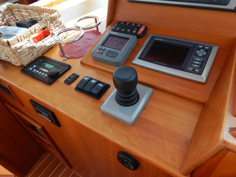 Slide: The Image of Control panel of a 2010 Sabre 40 Sedan yacht with navigation equipment. - 13