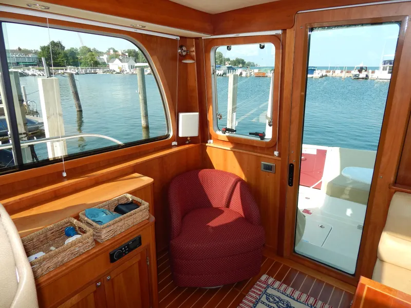 Slide: The Image of Interior of 2010 Sabre 40 Sedan yacht with waterfront view and cozy seating. - 21