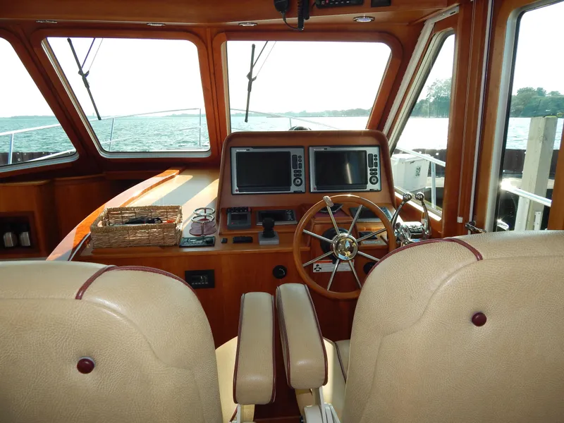 Slide: The Image of Interior of 2010 Sabre 40 Sedan yacht with steering wheel and navigation screens. - 33