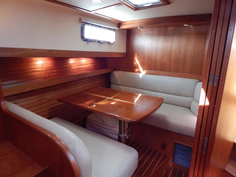 Slide: The Image of Luxurious interior of 2010 Sabre 40 Sedan yacht with wooden dining area. - 34