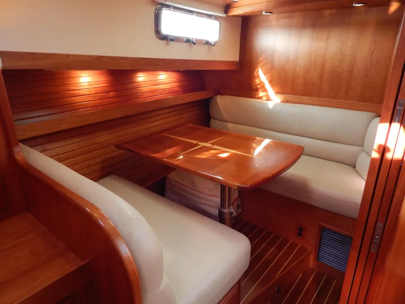Slide: The Image of Luxurious 2010 Sabre 40 Sedan interior with elegant wood finish and cozy seating area. - 35