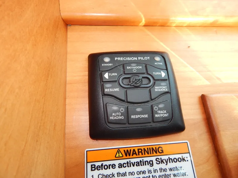 Slide: The Image of Control panel of a 2010 Sabre 40 Sedan boat with warning label. - 38