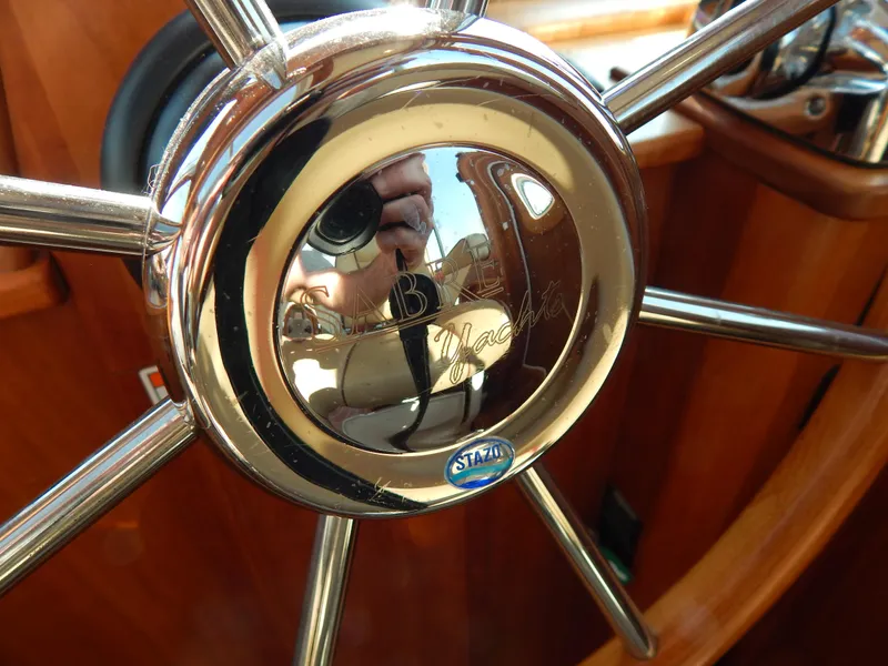 Slide: The Image of Close-up of a polished steering wheel on a 2010 Sabre 40 Sedan yacht. - 46