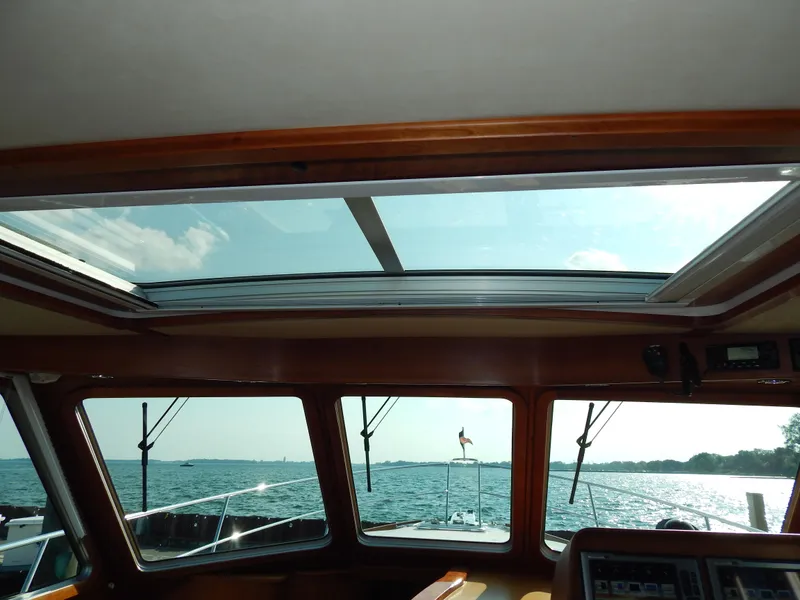 Slide: The Image of Interior view of 2010 Sabre 40 Sedan yacht with sunroof and ocean scenery. - 9