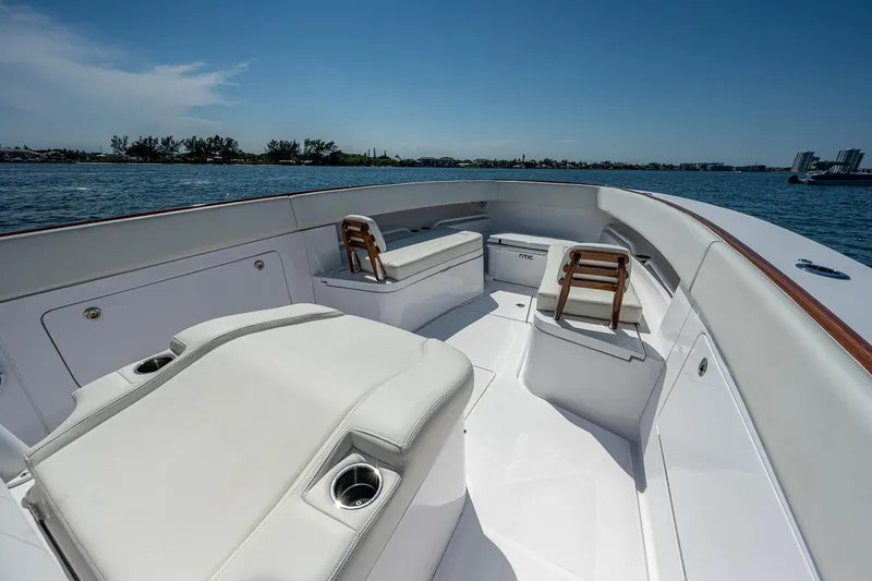 Slide: The Image of 2023 Jupiter 38 boat interior with white seating and ocean view. - 12