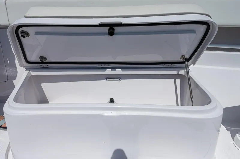 Slide: The Image of Open storage compartment on a 2023 Jupiter 38 boat, showcasing spacious interior. - 15