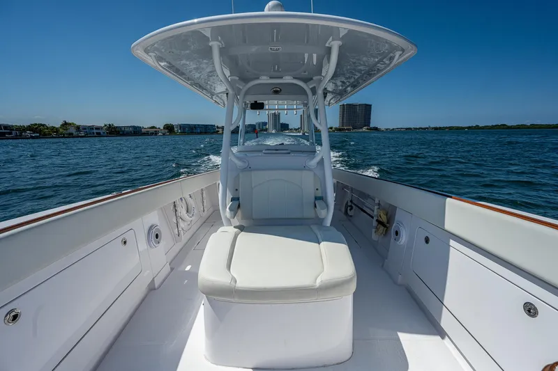 Slide: The Image of 2023 Jupiter 38 boat cruising on open water under clear blue sky. - 16