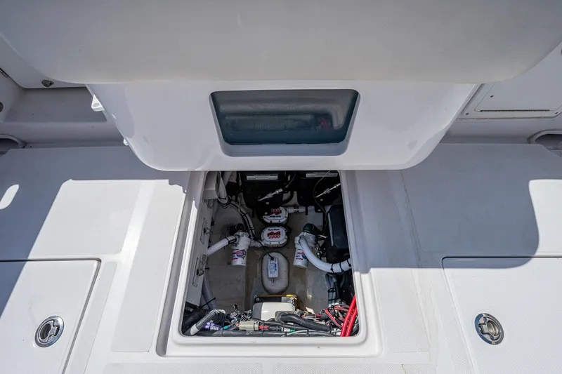 Slide: The Image of 2023 Jupiter 38 boat compartment showcasing internal wiring and components. - 22