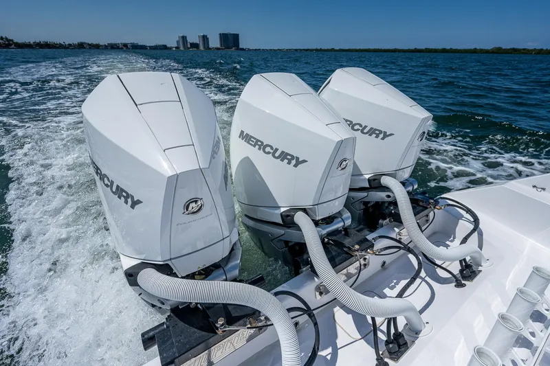 Slide: The Image of Triple Mercury outboard engines on 2023 Jupiter 38 boat cruising in open water. - 36