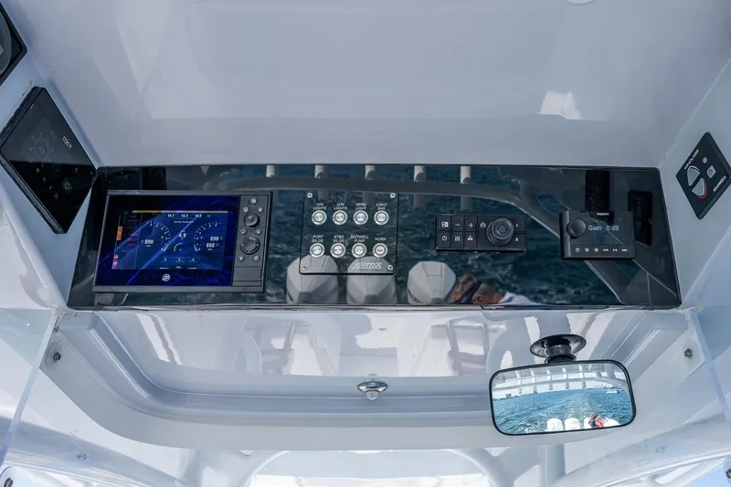 Slide: The Image of 2023 Jupiter 38 boat dashboard with advanced navigation and control systems. - 42