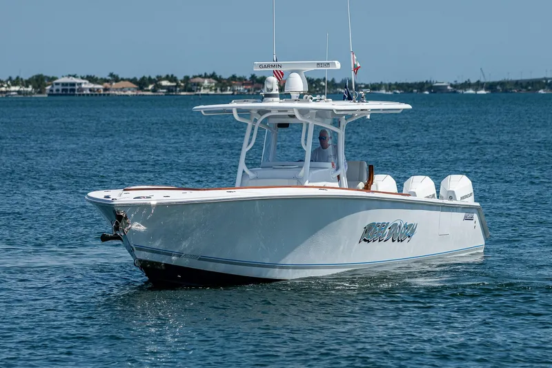 Slide: The Image of 2023 Jupiter 38 boat cruising on open water, featuring sleek design and powerful engines. - 48