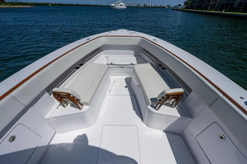 Slide: The Image of Bow view of 2023 Jupiter 38 boat with seating, on calm water. - 8