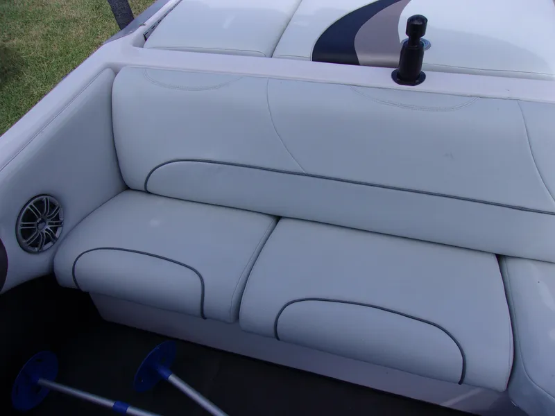 Slide: The Image of 2006 Correct Craft SUPER AIR NAUTIQUE 210 boat interior seating with speaker detail. - 9