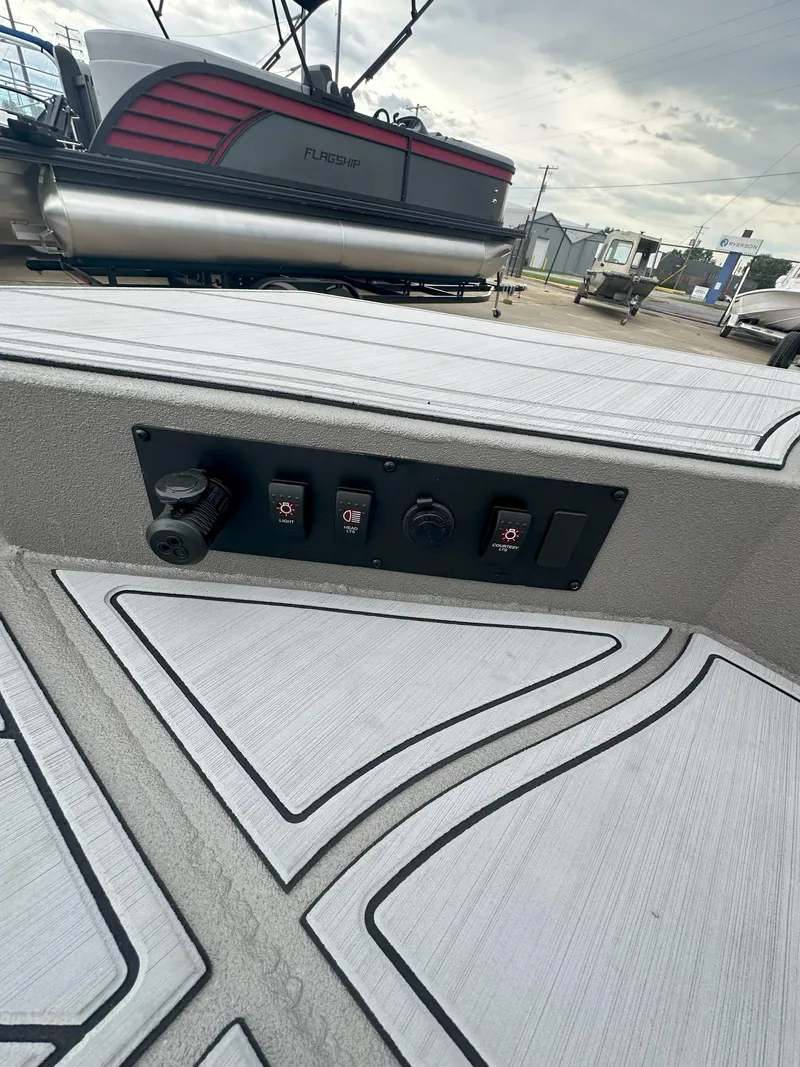 Slide: The Image of 2024 Thor 1900 Center Console boat interior with control panel and modern design. - 14