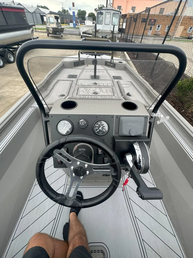 Slide: The Image of 2024 Thor 1900 Center Console boat interior with steering wheel and dashboard controls. - 15