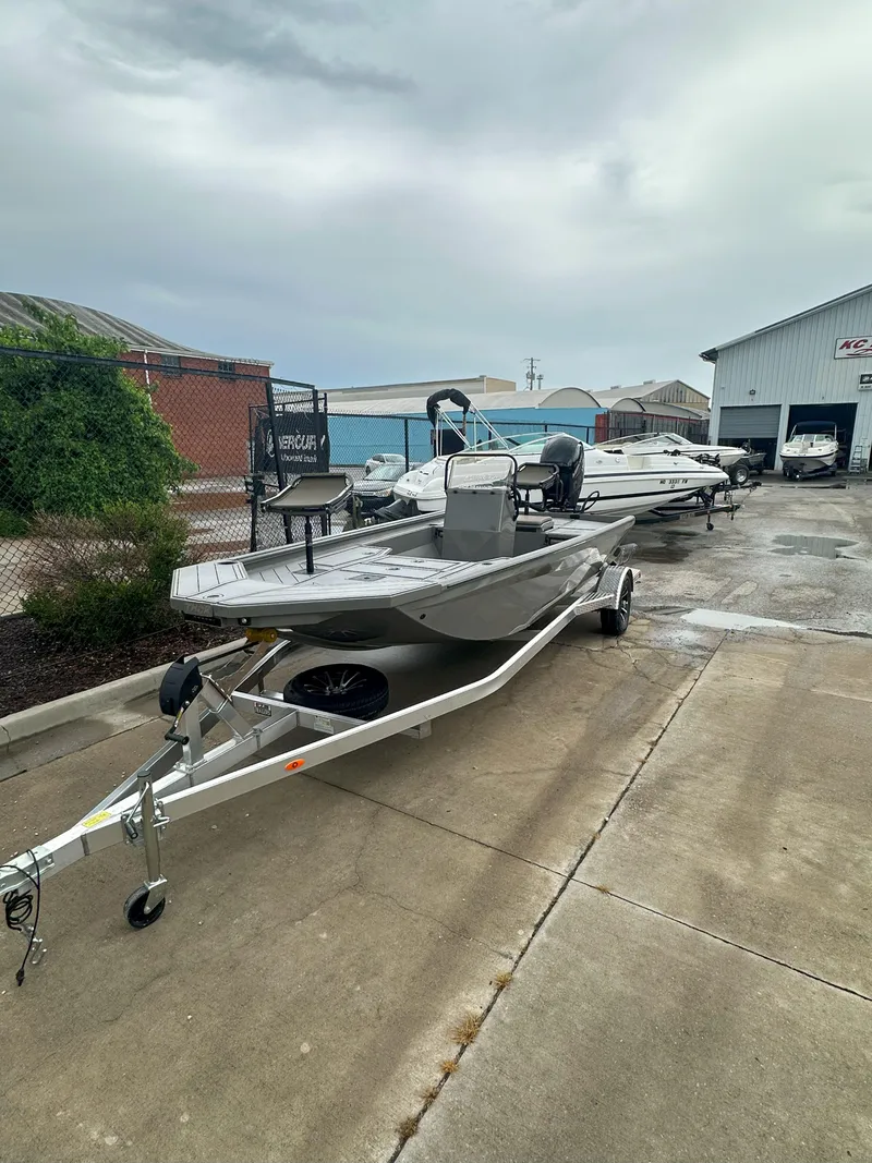 Slide: The Image of 2024 Thor 1900 Center Console boat on trailer in outdoor dealership lot. - 4