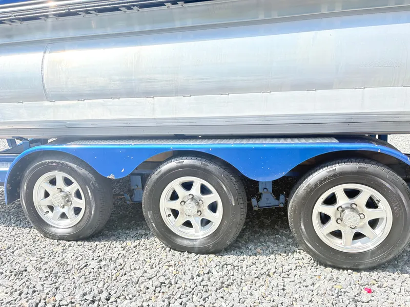 Slide: The Image of 2017 Manitou X-Plode Series 25 XT SRS SHP trailer wheels on gravel. - 3