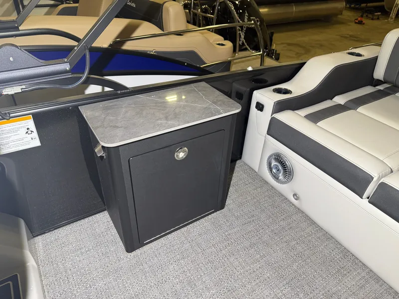Slide: The Image of Interior of the Barletta Corsa 25 UE with gray carpet and cushioned seating. - 23