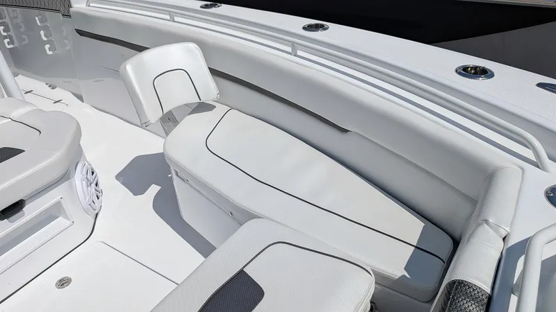 Slide: The Image of 2026 Wellcraft 302 Fisherman boat interior with white seating and sleek design. - 15
