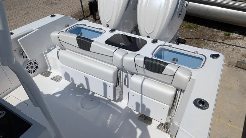 Slide: The Image of 2026 Wellcraft 302 Fisherman boat interior with seating and storage compartments. - 4