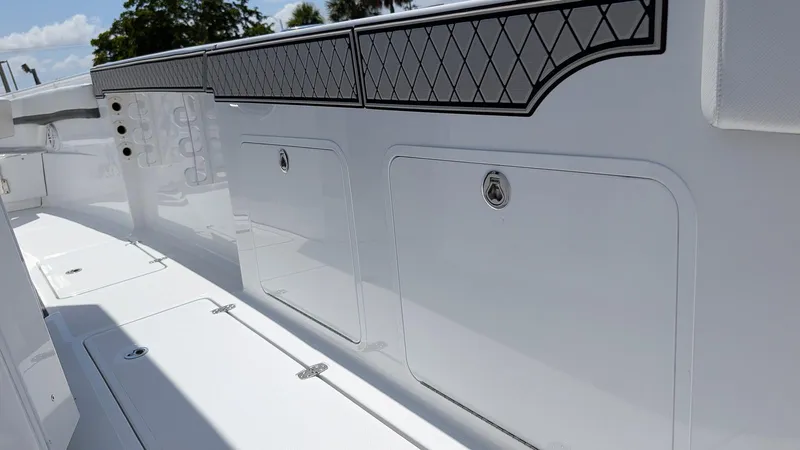 Slide: The Image of 2026 Wellcraft 302 Fisherman boat interior with storage compartments and sleek design. - 9
