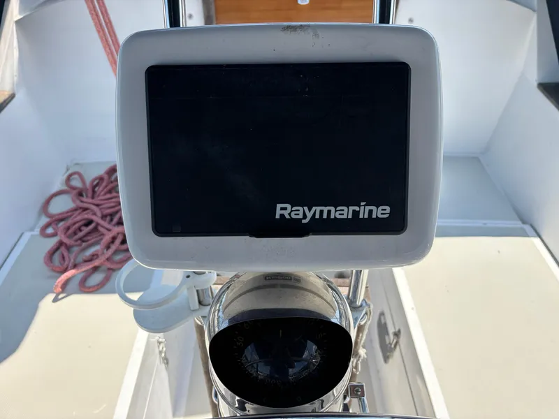 Slide: The Image of Raymarine navigation system on 1988 Bristol 33.3 sailboat, with coiled rope in background. - 10