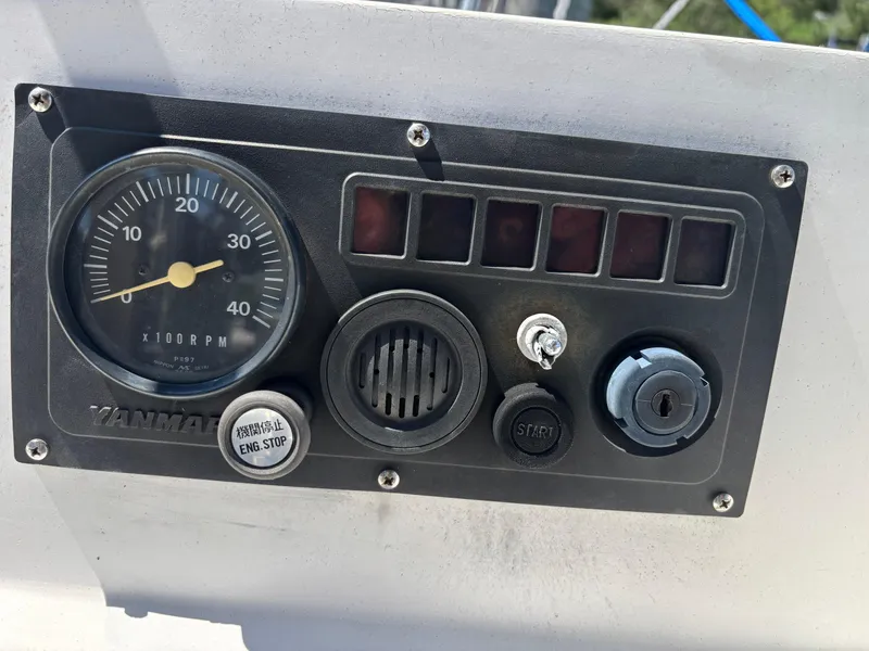 Slide: The Image of Control panel of a 1988 Bristol 33.3 boat with Yanmar RPM gauge. - 11