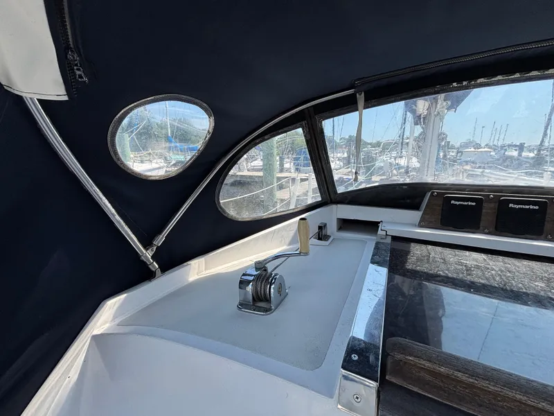 Slide: The Image of Interior view of a 1988 Bristol 33.3 sailboat cockpit with navigation equipment. - 12