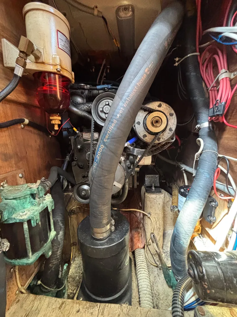 Slide: The Image of Engine compartment of a 1988 Bristol 33.3, showcasing hoses and mechanical components. - 28